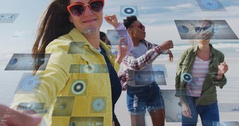 Friends taking selfie at beach with augmented reality panels overlaying coastal scene