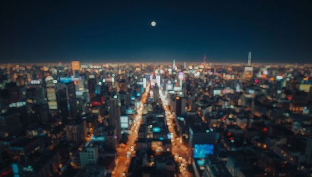 Majestic cityscape with blurred urban lighting and moonlit sky