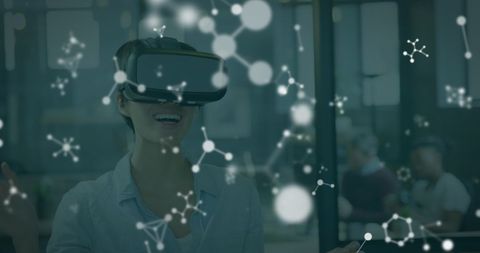 Woman Using VR Headset with Molecular Illustrations in Modern Office