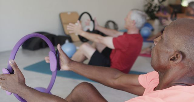 Senior Adults Practicing Pilates with Fitness Rings in Class - Download Free Stock Images Pikwizard.com