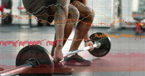 Athlete preparing loaded barbell on red mat with stock trading chart overlay