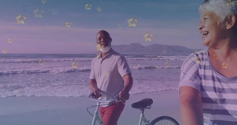 Senior Couple Enjoying Bicycle Ride on Scenic Beach
