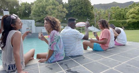 Diverse Friends Enjoying Lively Poolside Gathering in Slow Motion - Download Free Stock Images Pikwizard.com
