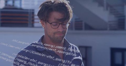Developer analyzing code overlay on urban rooftop terrace