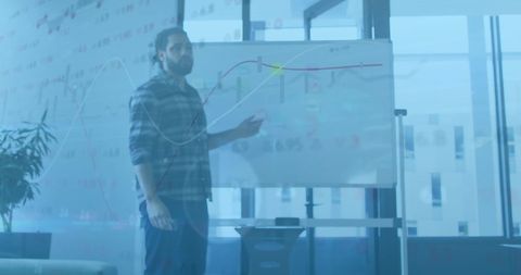 Financial businessman analyzing data on office whiteboard