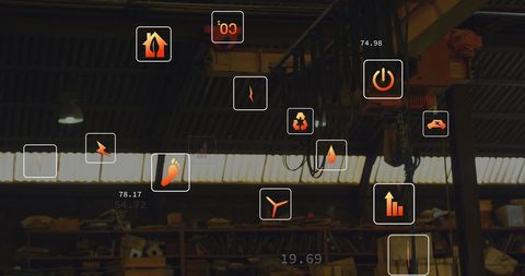 Digital Data Icons Overlaying Industrial Warehouse Interior