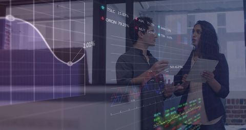 Two Professionals Discussing Financial Data with Digital Interface - Download Free Stock Images Pikwizard.com