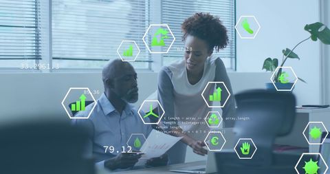 Diverse Coworkers Engaging in Strategic Tech Discussion in Office