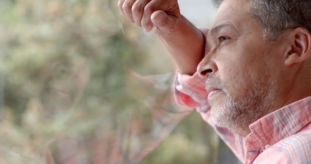 Contemplative Mature Man Staring Out Window - Download Free Stock Images Pikwizard.com