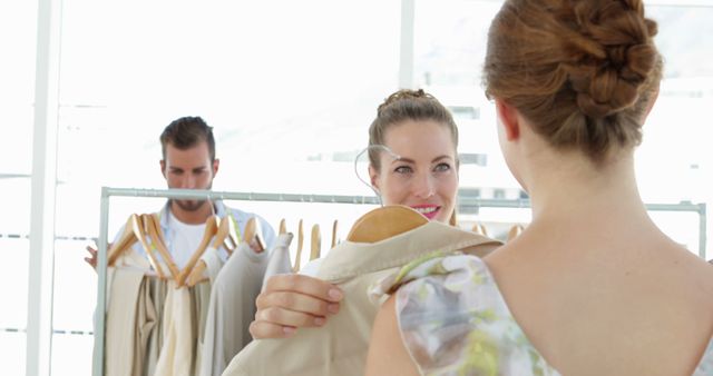 Woman Choosing Outfit in Fashion Boutique - Download Free Stock Images Pikwizard.com