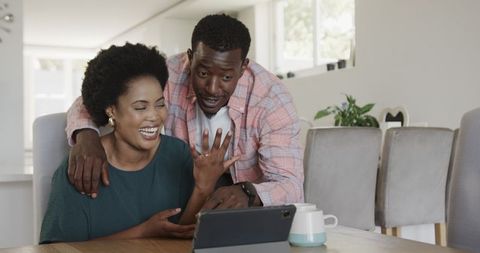 Happy Couple Enjoying Tablet Time Together at Home