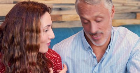 Man and Young Woman Sharing Personal Stories