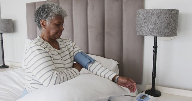 Senior Woman Measuring Blood Pressure at Home in Bedroom - Download Free Stock Images Pikwizard.com