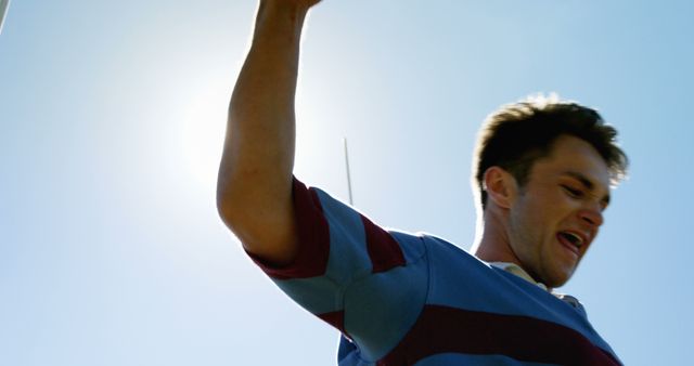 Young Man Celebrating under Sunny Sky - Download Free Stock Images Pikwizard.com