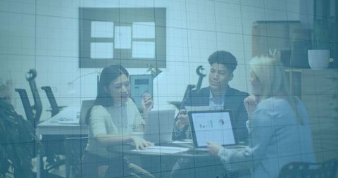 Business professionals collaborating on data analysis in modern office