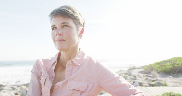 Thoughtful Middle-aged Woman Enjoying Sunny Beach - Download Free Stock Images Pikwizard.com