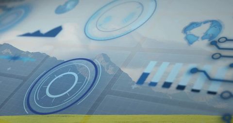 Futuristic ar data overlay projecting hud charts and globe over grassy plain and mountains