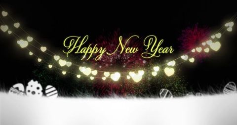 Festive happy new year against night sky with heart lights