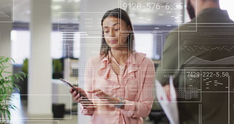 Woman Analyzing Digital Statistics in Modern Office Setting