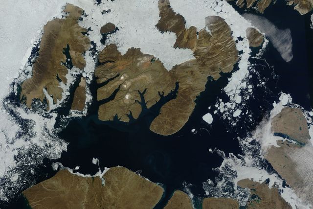 NASA image acquired August 17, 2010  In mid-August 2010, the Northwest Passage was almost—but not quite—free of ice. The ice content in the northern route through the passage (through the Western Parry Channel) was very light, but ice remained in McClure (or M’Clure) Strait.  The Moderate Resolution Imaging Spectroradiometer (MODIS) on NASA’s Terra satellite captured this natural-color image on August 17, 2010. Although most of McClure Strait looks perfectly ice-free, immediately west of Prince Patrick Island, a band of sea ice stretches southward across the strait (left edge of the image).    The National Snow and Ice Data Center Sea Ice News and Analysis blog reported that even more ice remained in the southern route (through Amundsen’s Passage) of the Northwest Passage in mid-August 2010. Nevertheless, the ice content in the northern route was not only well below the 1968–2000 average, but also nearly a month ahead of the clearing observed in 2007, when Arctic sea ice set a record low. As of mid-August 2010, however, overall sea ice extent was higher than it had been at the same time of year in 2007.  Credit: NASA/GSFC/Jeff Schmaltz/MODIS Land Rapid Response Team  Caption by Michon Scott.     To learn more go to: <a href="http://earthobservatory.nasa.gov/NaturalHazards/view.php?id=45333" rel="nofollow">earthobservatory.nasa.gov/NaturalHazards/view.php?id=45333</a>  Instrument: Terra - MODIS  <b><a href="http://www.nasa.gov/centers/goddard/home/index.html" rel="nofollow">NASA Goddard Space Flight Center</a></b>  is home to the nation's largest organization of combined scientists, engineers and technologists that build spacecraft, instruments and new technology to study the Earth, the sun, our solar system, and the universe.  <b>Follow us on <a href="http://twitter.com/NASA_GoddardPix" rel="nofollow">Twitter</a></b>  <b>Join us on <a href="http://www.facebook.com/pages/Greenbelt-MD/NASA-Goddard/395013845897?ref=tsd" rel="nofollow">Facebook</a><b>  Click here to see more images from <b><a href="#//earthobservatory.nasa.gov/" rel="nofollow"> NASA Goddard’s Earth Observatory</a></b></b></b>