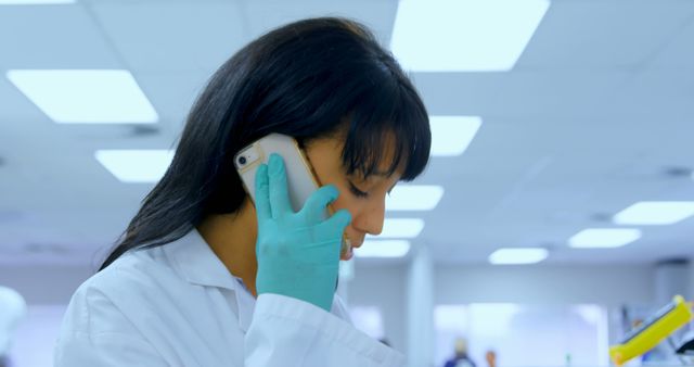 Female Scientist on Phone in Laboratory - Download Free Stock Images Pikwizard.com