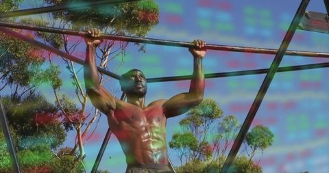 Determined athlete performs pull-ups on outdoor metal bar