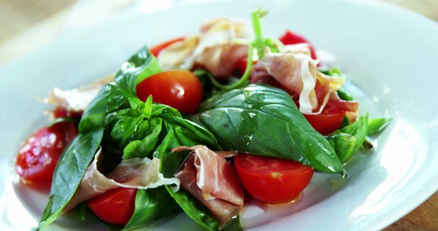 Fresh and Delicious Prosciutto Salad with Basil and Cherry Tomatoes - Download Free Stock Images Pikwizard.com