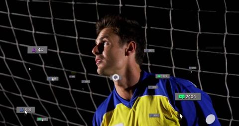 Soccer Goalkeeper with Digital Engagement Icons at Night Stadium