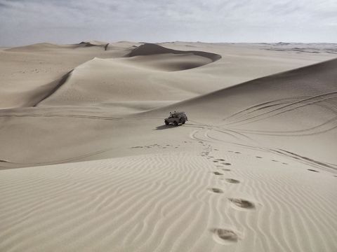 4x4 Adventure Vehicle on Expansive Sand Dunes