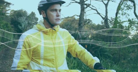 Cyclist navigating forest path on scenic adventure ride