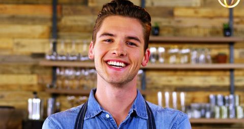 Cheerful Waiter in Relaxed Café Setting - Download Free Stock Images Pikwizard.com