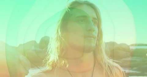 Serene man embracing nature with contemplative expression