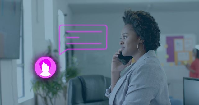 Chat icon and speech bubble over african american casual businesswoman on phone in office. Casual business, at, web chat, digital interface, network and communication digitally generated image.
