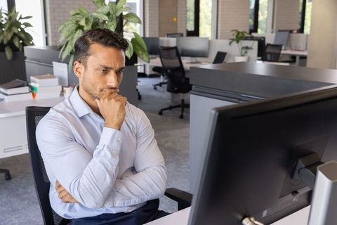 Focused Male Professional Working in Modern Office Environment