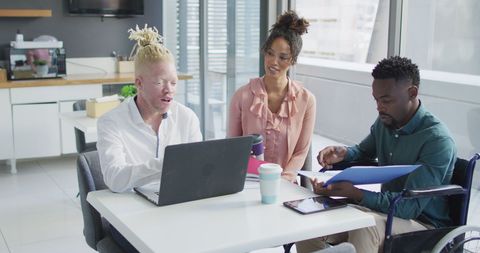 Diverse Team Collaborating with Disabled Colleague in Modern Office - Download Free Stock Images Pikwizard.com