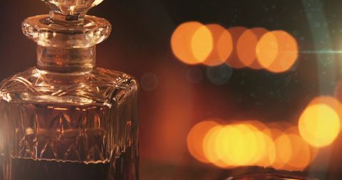 Elegant Wine Decanter with Festive Bokeh Lights