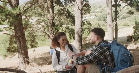 Happy Couple Enjoying Hiking Adventure in Sunlit Forest - Download Free Stock Images Pikwizard.com
