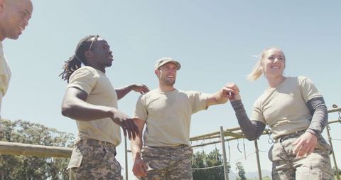 Diverse Military Team Celebrating Outdoor Success