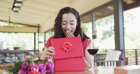 Woman Surprised by Gift at Valentine's Day Celebration - Download Free Stock Images Pikwizard.com