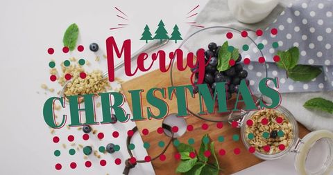 Merry christmas breakfast flatlay with blueberries, granola and mint festive overlay