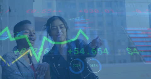 Businesswomen Analyzing Digital Financial Charts in Cityscape