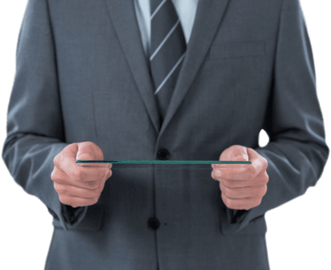 Businessman holding transparent digital tablet in suit