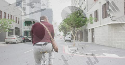 Office worker cycling in urban street