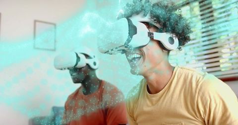 Friends laughing while experiencing immersive virtual reality gaming with VR headsets