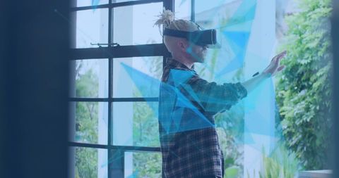 Man utilizing vr headset with futuristic digital overlays
