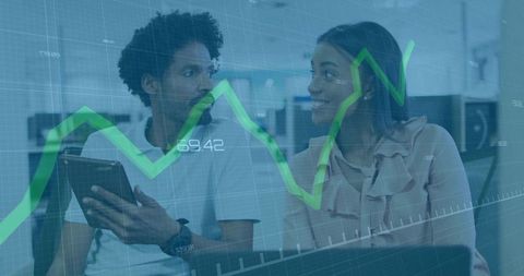 Office professionals discussing business data with chart overlay