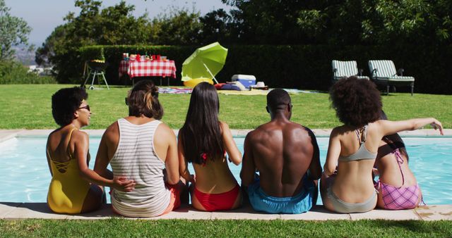Diverse group of friends sitting in a row at a pool party - Download Free Stock Photos Pikwizard.com