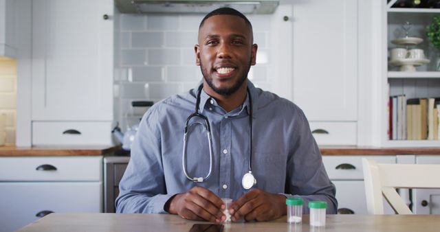 Smiling Male Doctor at Home Healthcare Consultation - Download Free Stock Images Pikwizard.com