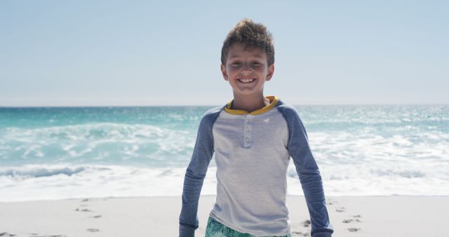 Smiling Boy Enjoying Sunny Beach Day - Download Free Stock Images Pikwizard.com