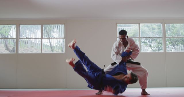 Martial Artist Throwing Opponent in Judo Gym - Download Free Stock Images Pikwizard.com